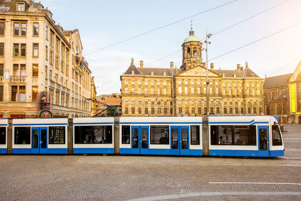 GVB tram passing the Royal Palace on Dam Square