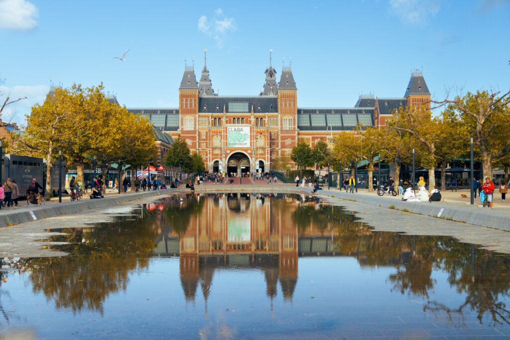 Rijksmuseum reflected in the water on Museumplein