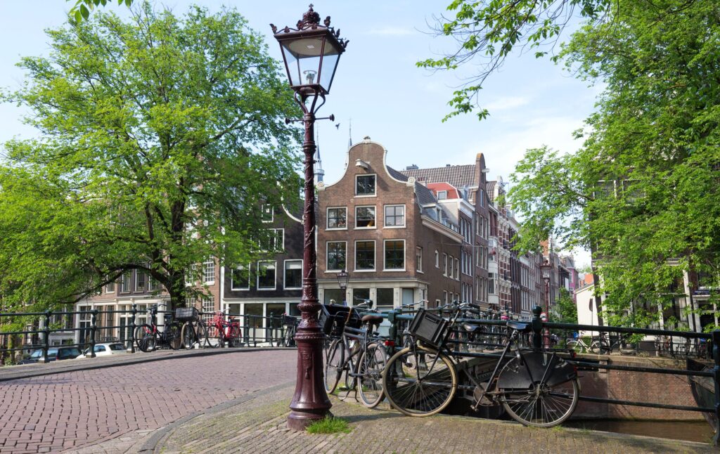Street lamp, bicycles and a canal bridge in the Jordaan