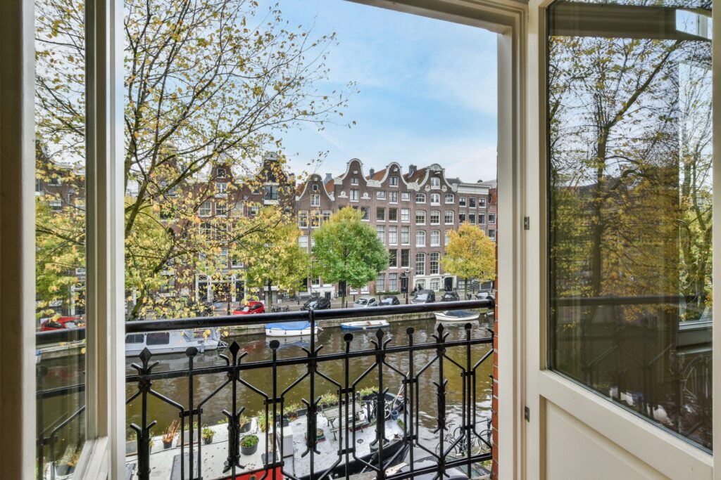View of an Amsterdam canal from a hotel balcony